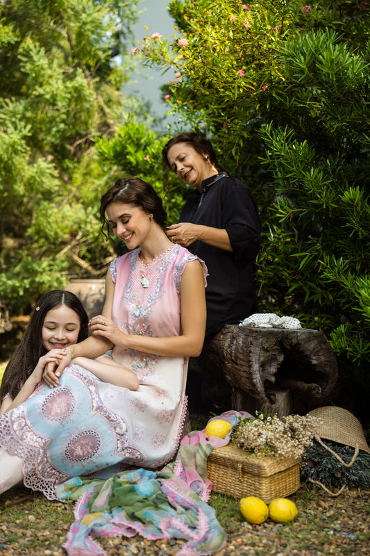 Model wearing Mushq Solace Sorisso MSL2502 pastel embroidered formal dress from 2025 collection.