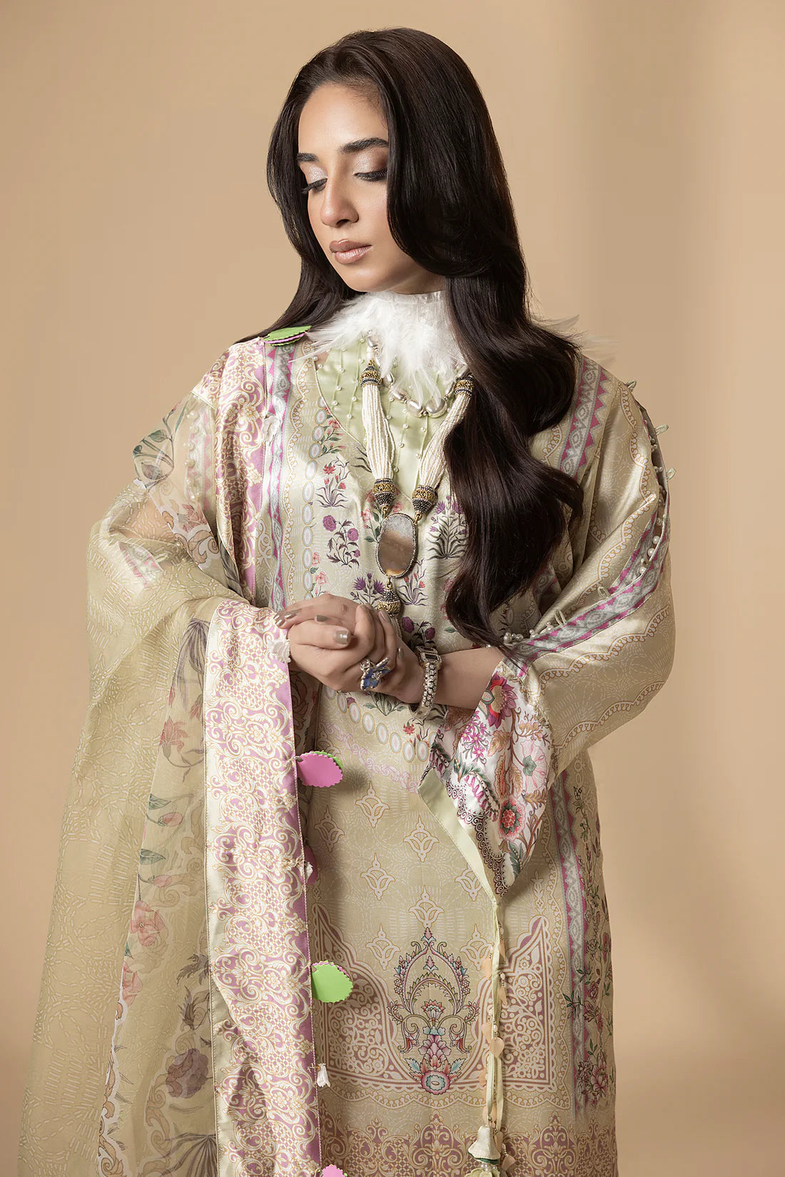 Close-up of neckline embroidery on Farah K Daffodil Dawn suit in ivory and lemon yellow.